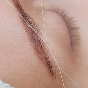 Threading treatments for eyebrows and lips